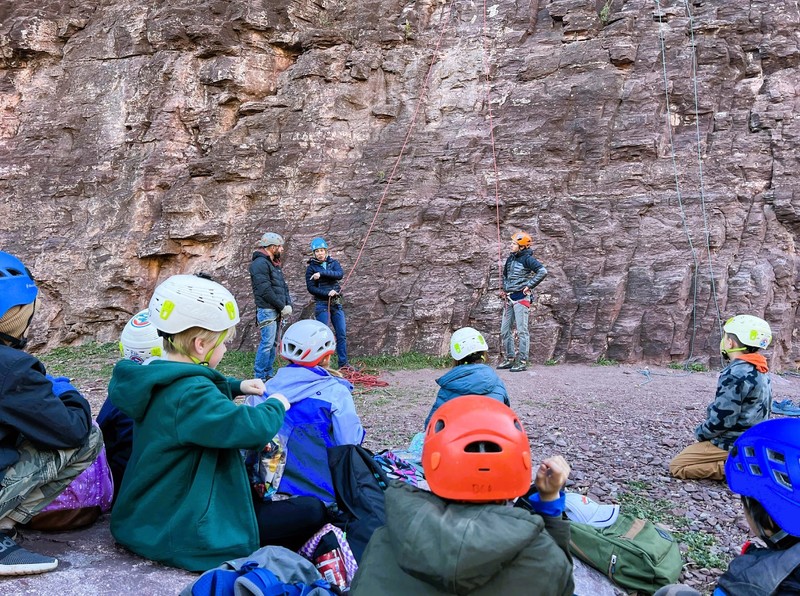 Students listening to climbing instructors